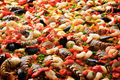 Seafood Paella cooking in giant Pan